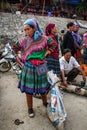 Flower hmong woman checking goods at the Bac Ha Market, Lao Cai, Vietnam Royalty Free Stock Photo